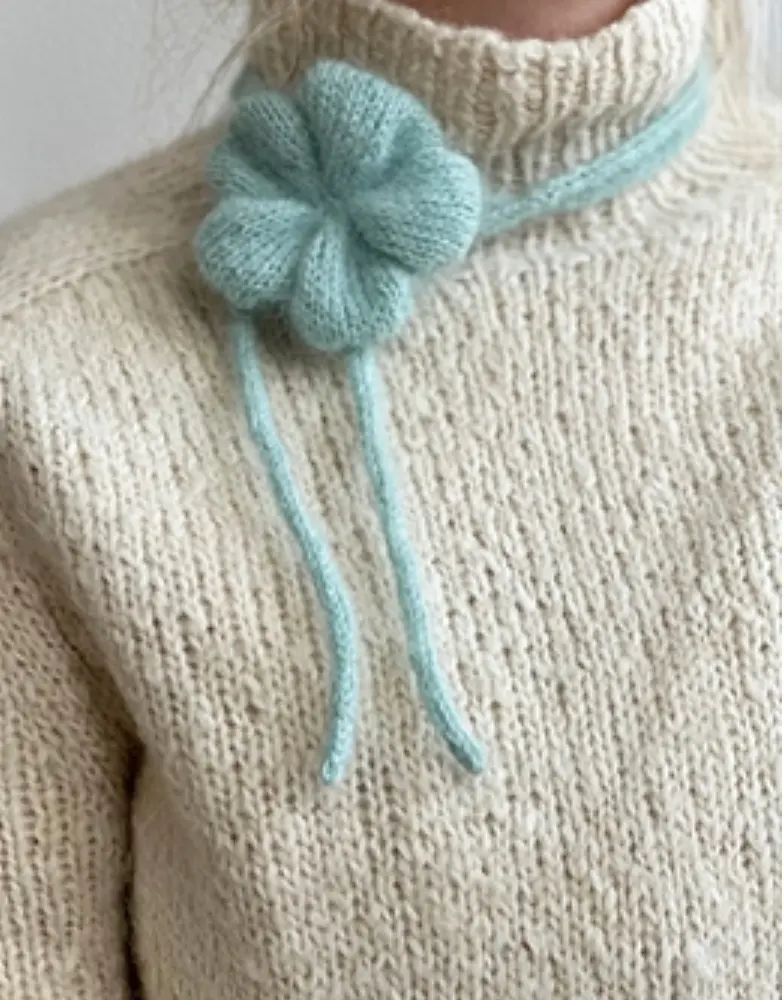 En strikkede blomst til strik på farten